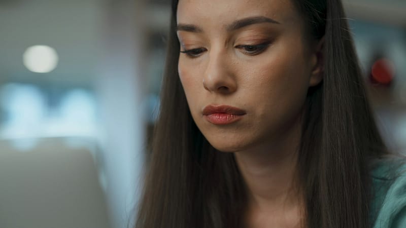 Focused businesswoman searching laptop in office closeup. Employee checking data